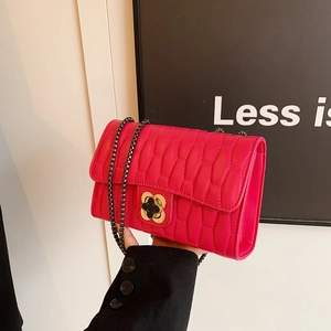 Quilted rose red leather chain bag with golden floral turn-lock and chain strap