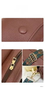Detailed shot of brown litchi leather texture with ethnic embroidered wide strap