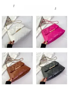 Quilted chain shoulder bag detail showing white, rose pink, brown and black colors