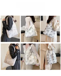 Multiple views of a large white plush tote bag featuring black butterfly prints