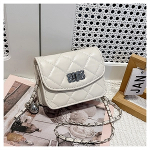 Close-up of white quilted chain bag with elegant silver hollow-out twist lock detail