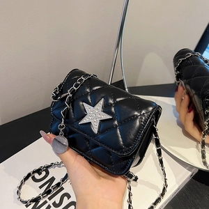 Mini black quilted leather crossbody bag with sparkling star and silver chain strap