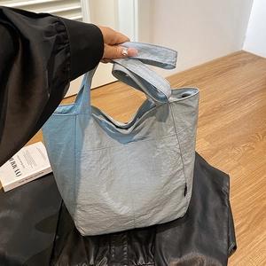 Light blue nylon tote bag with large capacity and crinkled texture for daily commuting