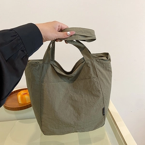 Minimalist olive green nylon tote bag with waterproof texture and large capacity