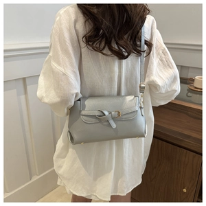 Model view showing the large capacity silver crossbody bag with metallic texture