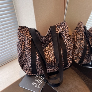 Fashionable leopard print tote bag with black handles and side pocket for women