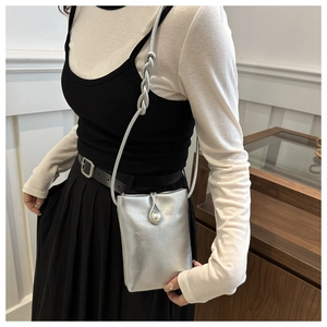 Silver mini crossbody bag featuring pearl decorative buckle and twisted shoulder strap
