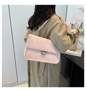 Pink marble texture PU leather shoulder bag with silver chain strap on model