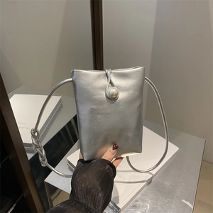 Silver mini crossbody phone bag with a large pearl buckle and woven shoulder strap
