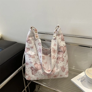 White tote bag with pink butterfly print and wide shoulder strap in high-quality texture