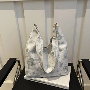 Large capacity tote bag with green butterfly and constellation prints and gold hardware