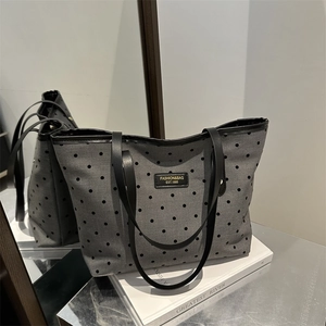 Fashionable grey polka dot tote bag with large capacity and black handles for daily use