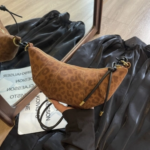 Minimalist leopard print croissant crossbody bag with knot shoulder strap and metal rings