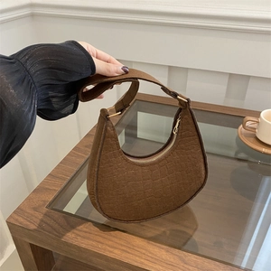 Retro brown crescent shoulder bag with crocodile embossed texture and metal zipper