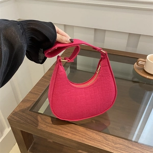 Magenta crescent shoulder bag with crocodile texture and golden zipper detail
