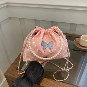 Pink polka dot bucket bag with pearl handle and silver butterfly charm for women