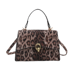 Front view of leopard print crossbody bag with metal twist lock and top handle