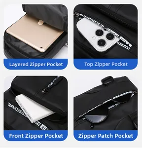 Detail showing multiple zipper compartments and storage layout of the black nylon chest bag