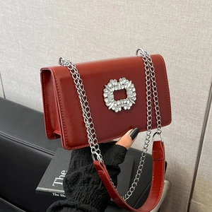 Elegant red shiny square chain bag with sparkling crystal buckle and metallic strap