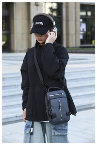 Detailed view of dark grey waterproof sling bag with professional webbing and nylon fabric