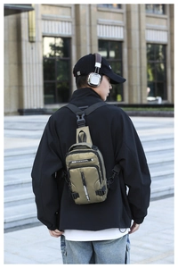 Detailed back view of an olive green waterproof tactical chest bag for men