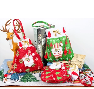 Detail of Christmas drawstring gift bags with 3D Santa and Snowman embroidery appliques