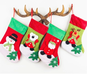 Detailed view of four festive Christmas stockings with 3D Santa, snowman, bear, and reindeer