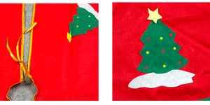 Detail of red felt Christmas tree skirt showing green tree applique and gold tie fastener