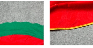 Detailed view of red Christmas tree skirt with green scalloped edges and gold piping