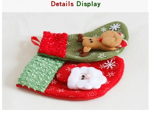 Detail view of mini Christmas stockings featuring Santa and reindeer with plush cuffs