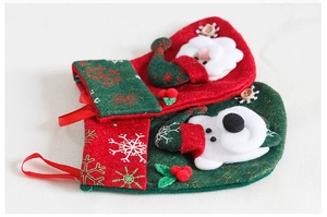 Detail of 3D Santa and polar bear appliques on thick felt Christmas stockings and ornaments