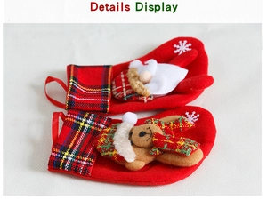 Detail view of red velvet Christmas stockings with plaid trim and 3D cartoon characters