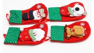 Detailed view of 4 mini Christmas stockings with 3D Santa, Snowman, Bear, and Reindeer dolls