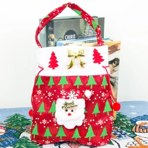 Festive Christmas gift bag featuring Santa Claus doll with red fabric and drawstring handle