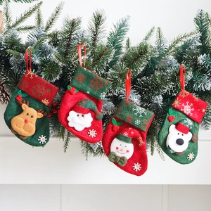 Set of 4 vintage Christmas stockings with reindeer, Santa, snowman and polar bear characters