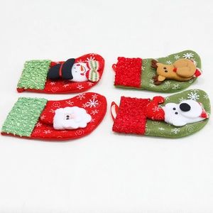 Set of four Christmas stockings with plush trim and snowflake patterns for tree decoration