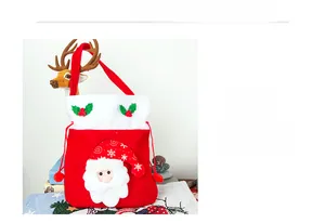 Detail of red plush Christmas gift bag with 3D Santa Claus and snowflake embroidery