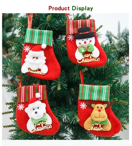 Set of 4 small Christmas stockings with 3D Santa and Reindeer hanging on a tree