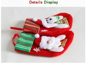 Detail of Christmas stocking gift bags with knitted cuffs and Merry Christmas gold lettering