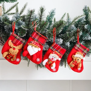 Set of 4 Christmas stockings with plaid cuffs and 3D character hanging on pine branch