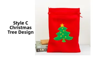 Detail of red velvet Christmas gift bag featuring green tree embroidery and drawstring