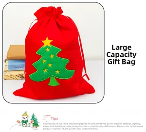 Detail showing red velvet Christmas gift bag with embroidered tree and drawstring closure