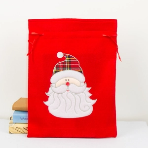 Red velvet Christmas gift bag with Santa Claus embroidery and drawstring closure