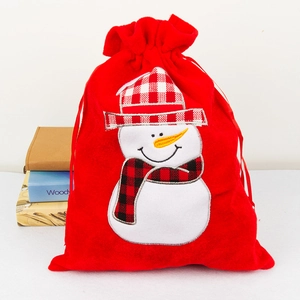Red velvet Christmas drawstring gift bag with embroidered snowman and plaid hat