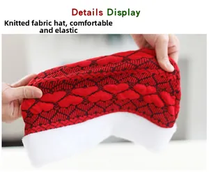 Detail showing high elasticity of the knitted Christmas hat with heart patterns and plush brim