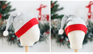 Detail of silver mesh Christmas hat with sequin patterns and red plush trim for holiday