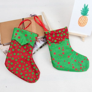 Red and green polka dot burlap Christmas stocking gift bags for holiday tree decoration