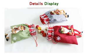 Detail view of burlap Christmas gift bags with 3D Santa, Snowman and Reindeer dolls