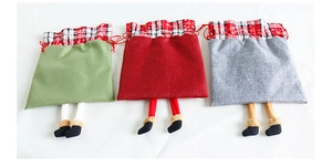 Three linen Christmas gift bags with long hanging legs and red white checkered trim details