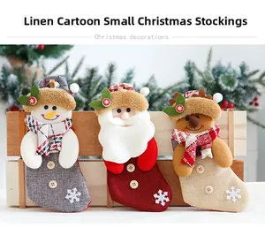 Detailed view of burlap Christmas stockings featuring Santa, snowman and reindeer designs